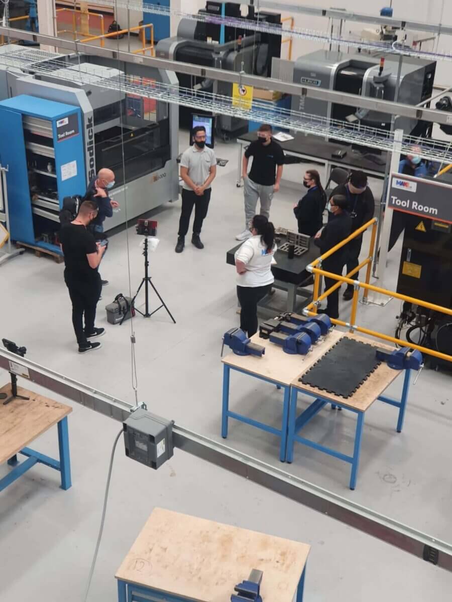 Set of a manufacturing video production at a factory.