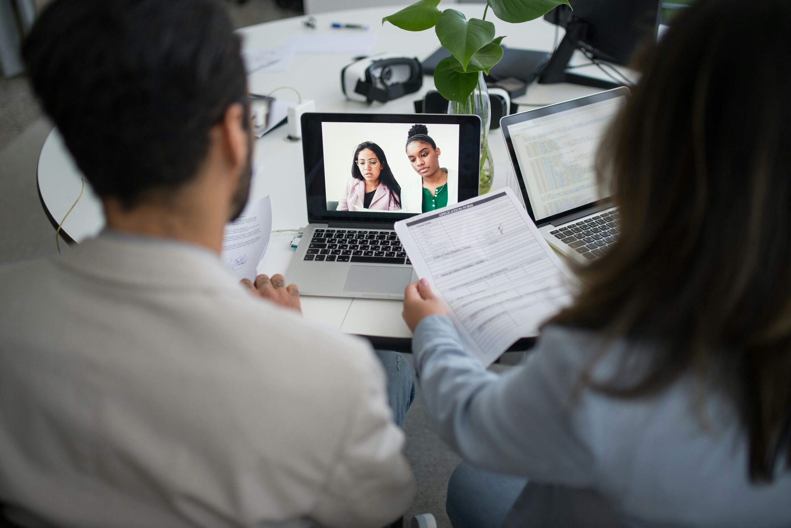 Team reviewing corporate video performance during a remote meeting