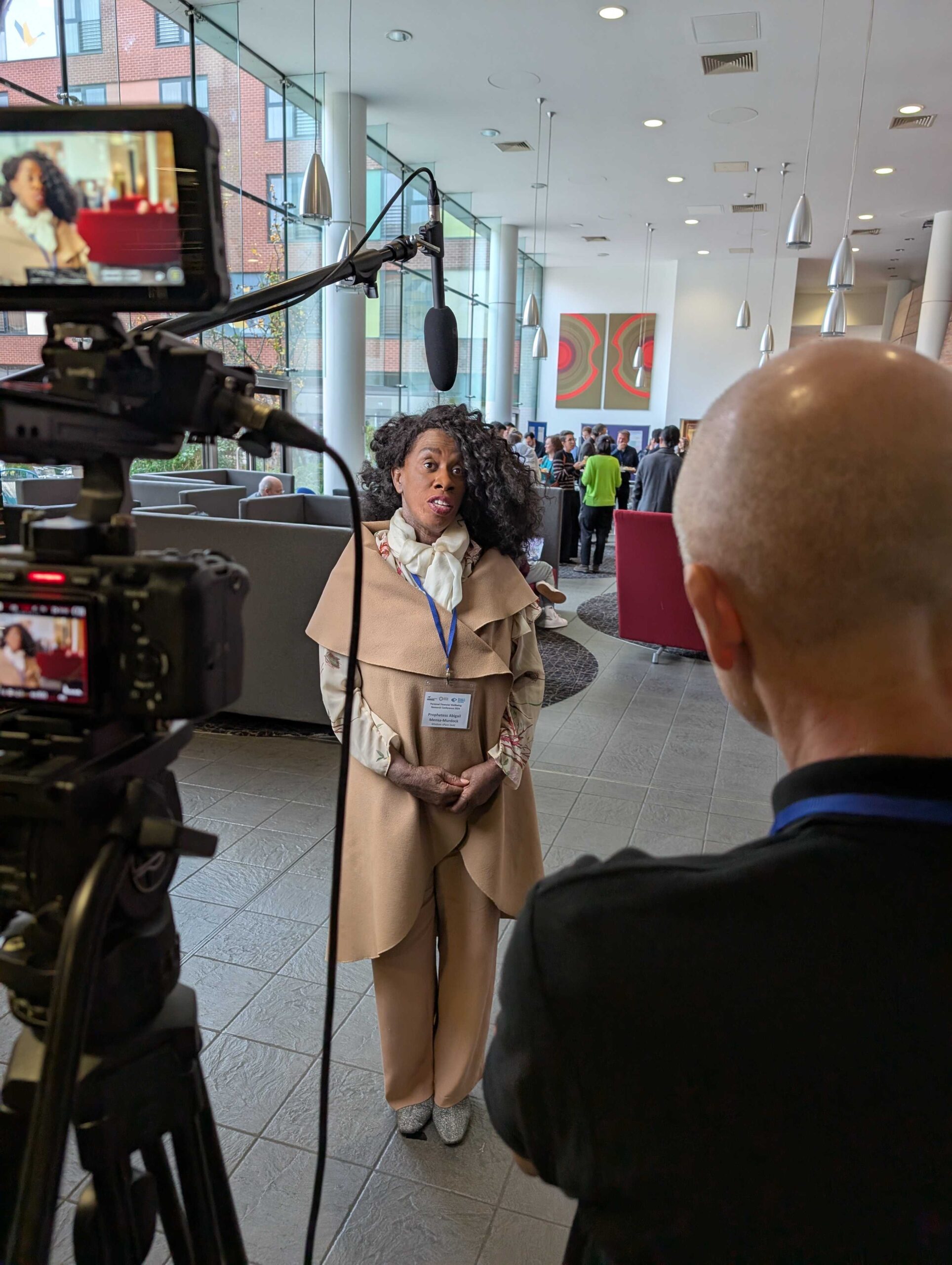 Woman filming testimonial on camera at Aston