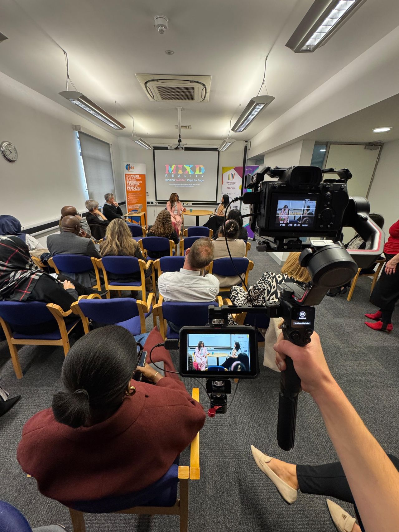 BTS of a conference being filmed with a single camera