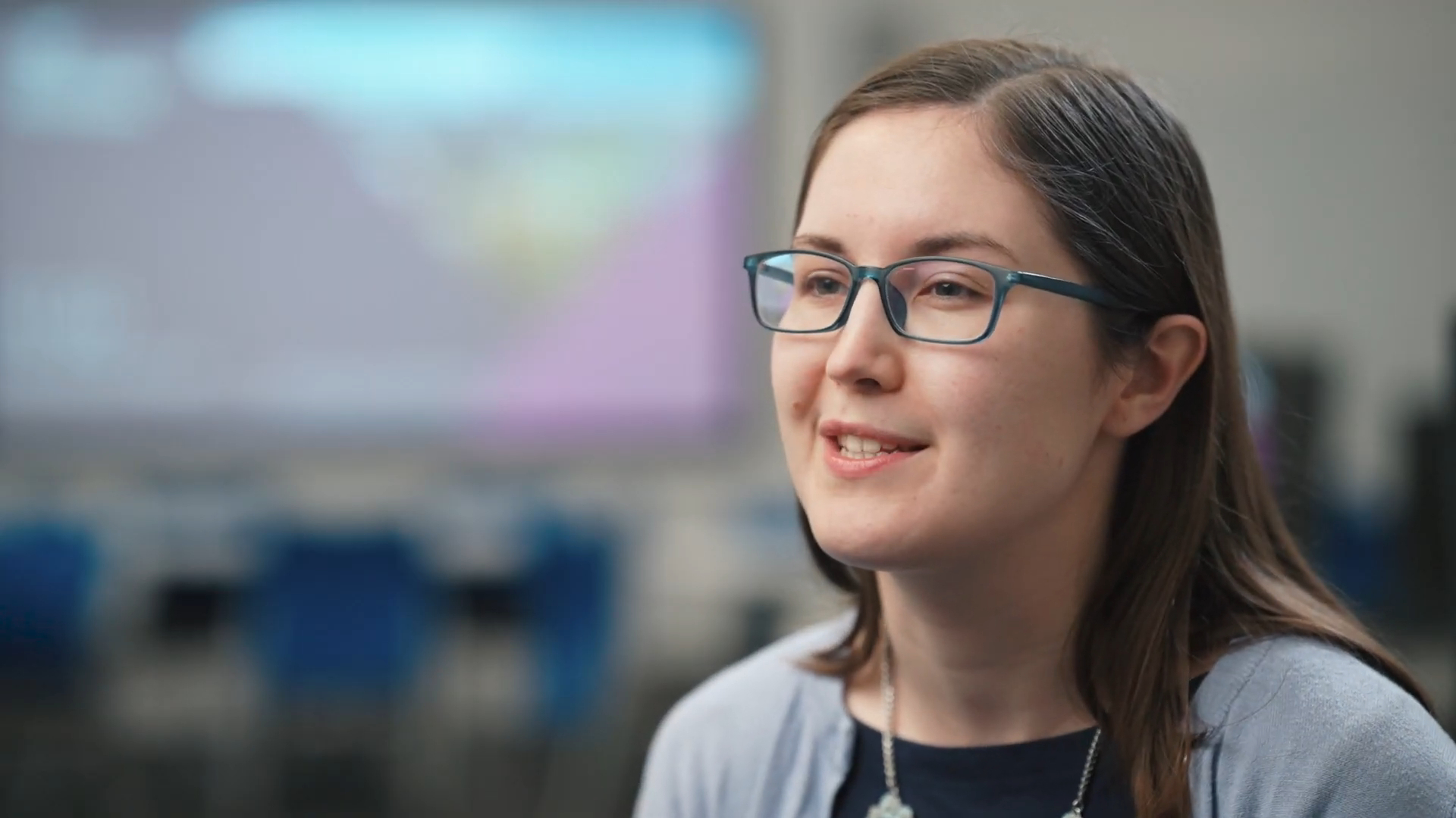 A professional woman speaking in an interview setting, ideal for testimonial video production in Birmingham.