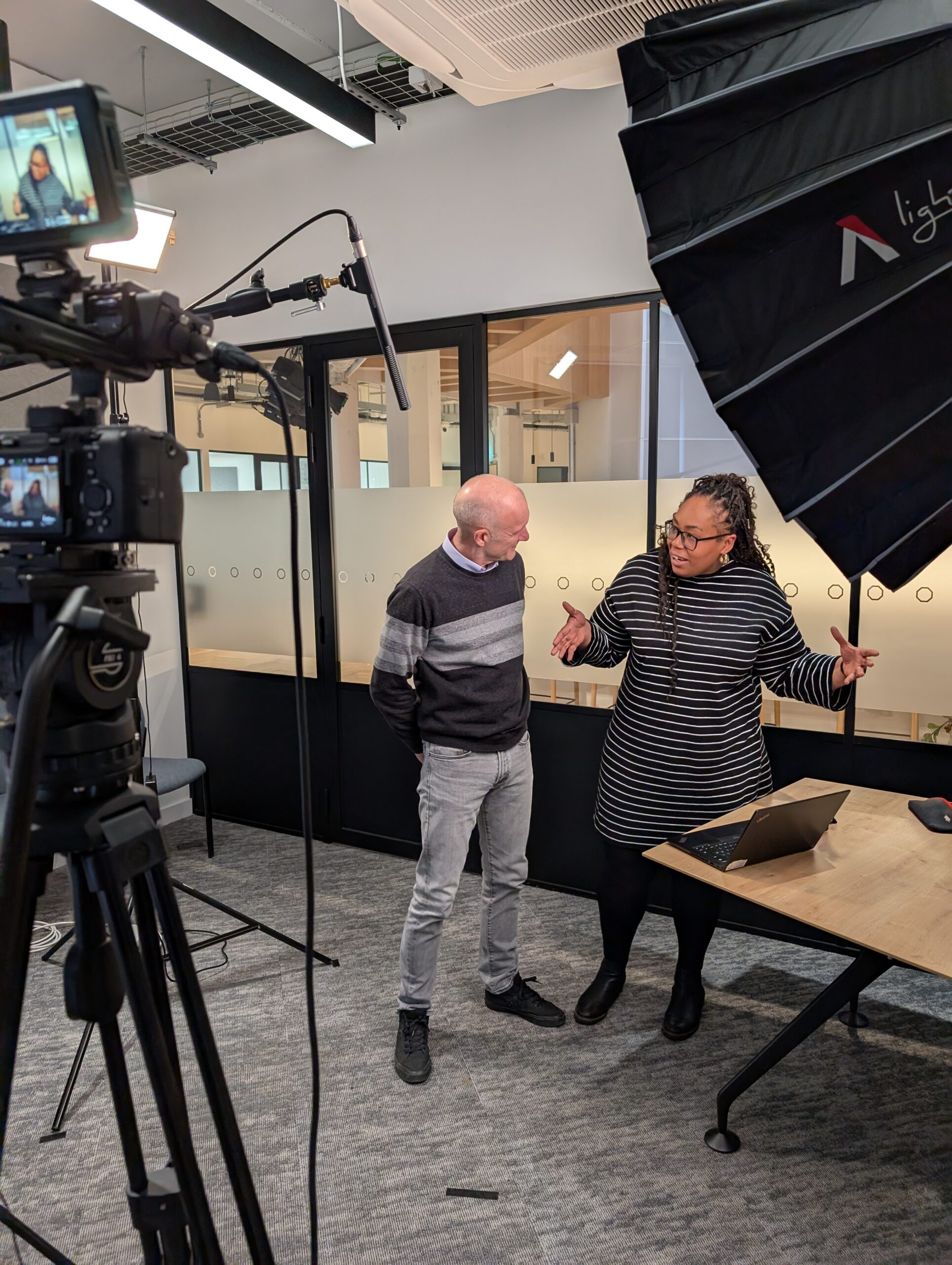 Mitch from CMA Video talking through a shoot with a client in Birmingham