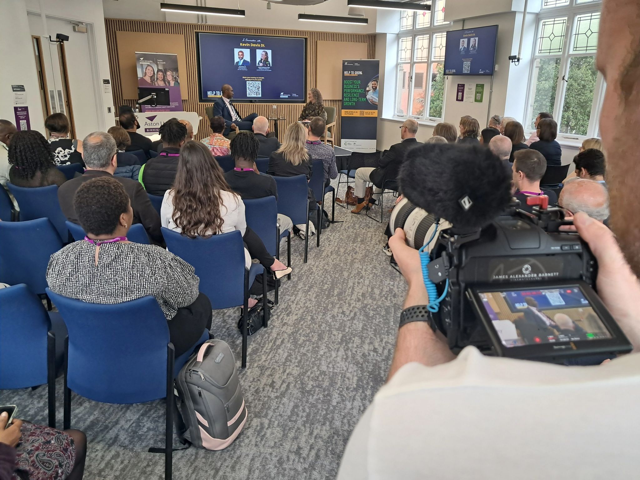 CMA Video camera operator filming a live business event