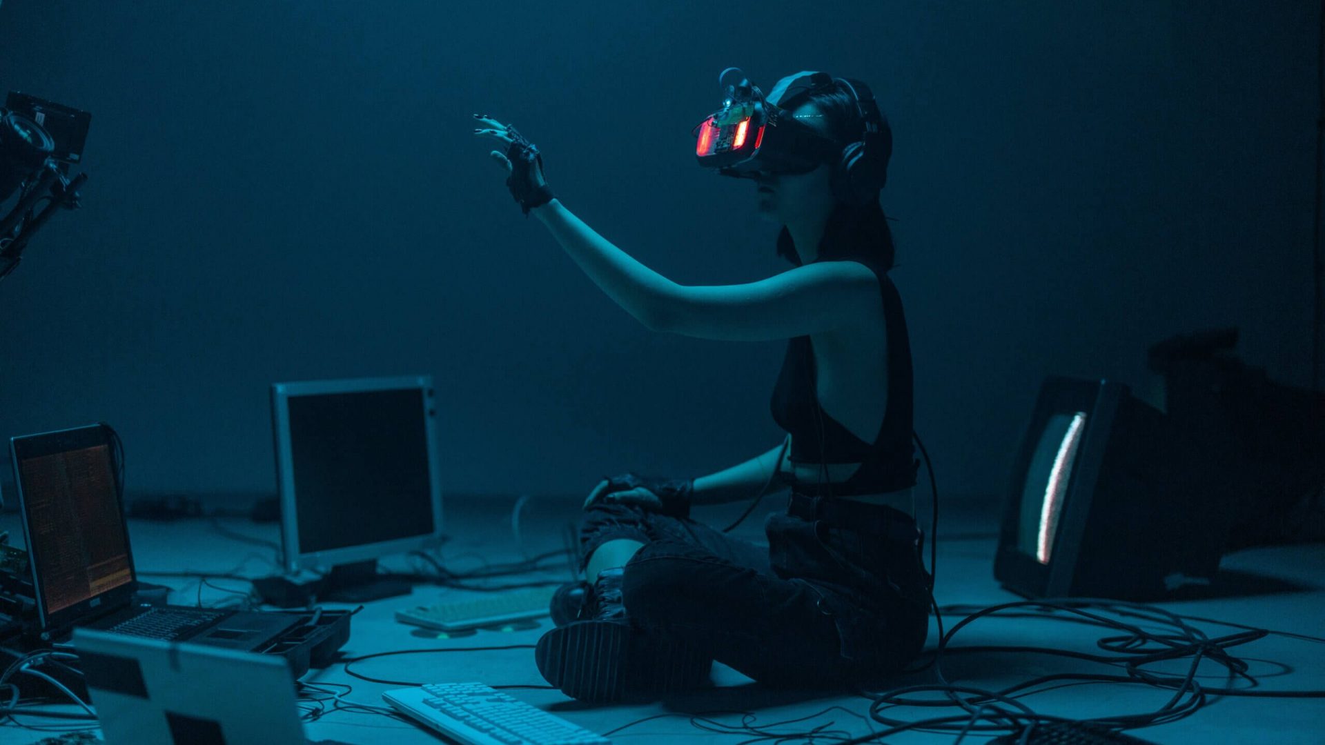 A Woman in a Tank Top Using a VR Headset