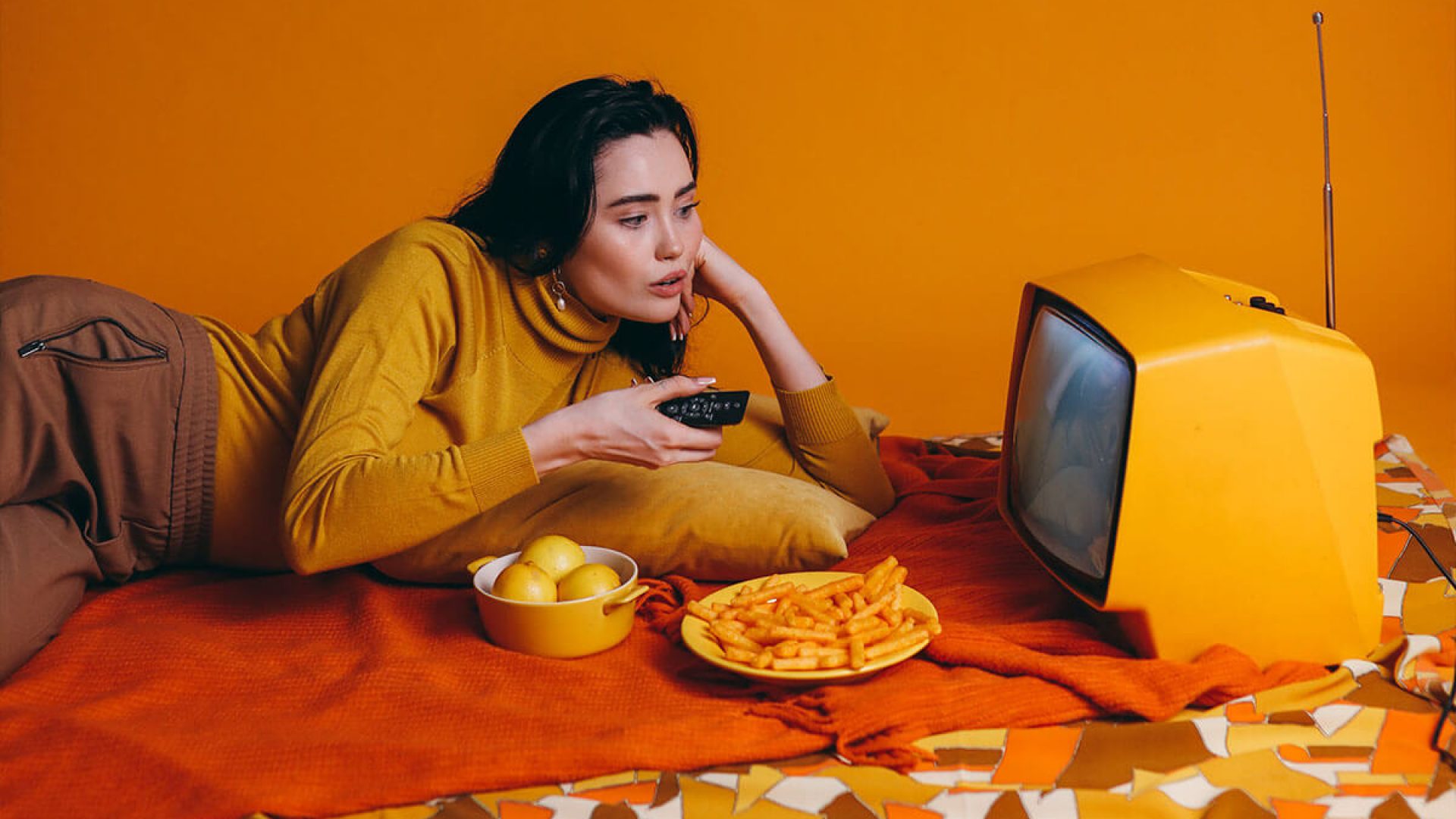 Woman In Yellow Long Sleeve Shirt Watching Tv