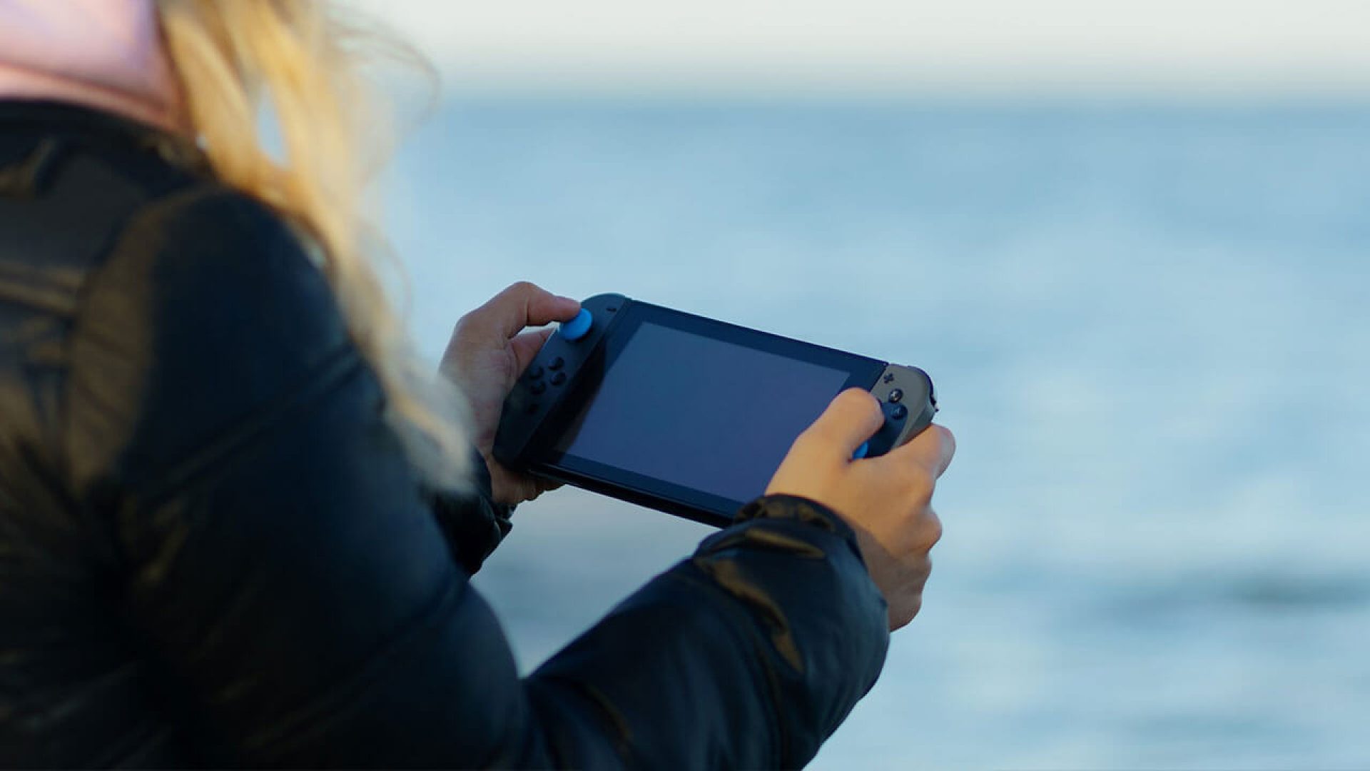 woman playing on an nintendo switch